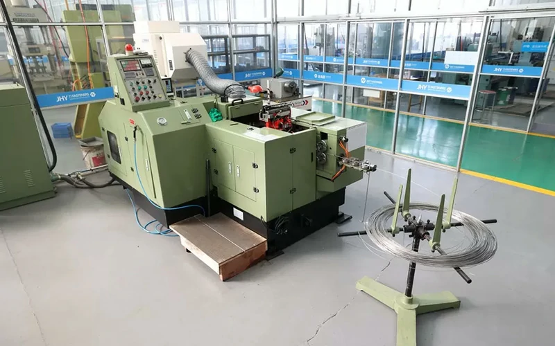 Cold heading machine used in titanium fastener production