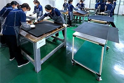 Alt:Workers applying MMO coating to titanium anode plates